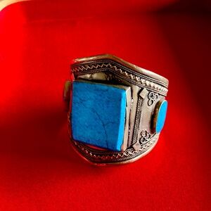 Beautiful silver metal with large turquoise stones mined in Afghanistan.